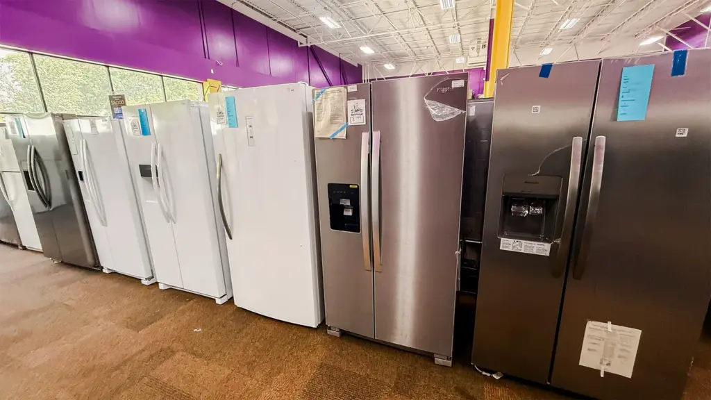 White and stainless refrigerators at Compare Deals appliance outlet