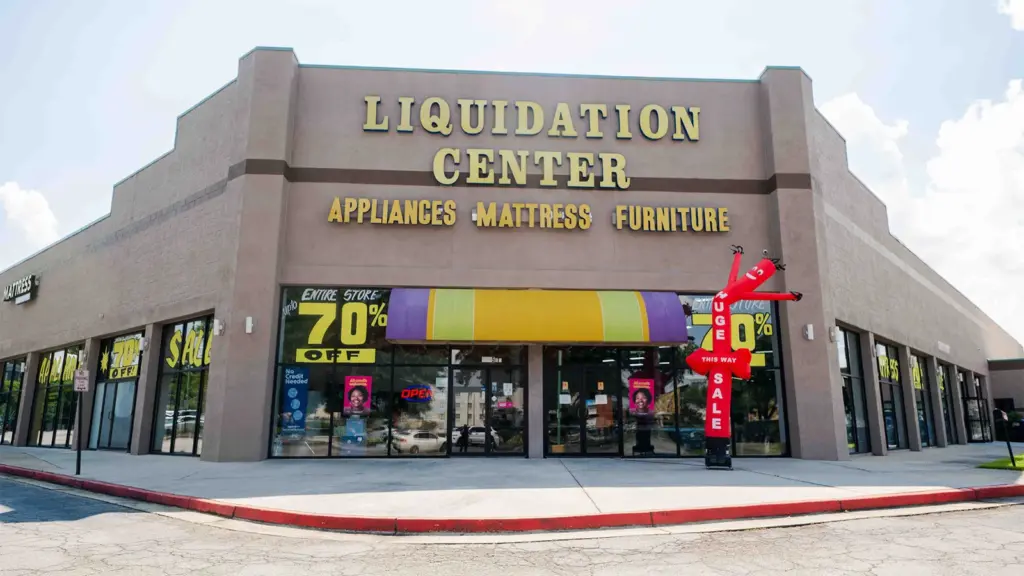 Compare Deals outlet storefront showing financing and 70% off window banners